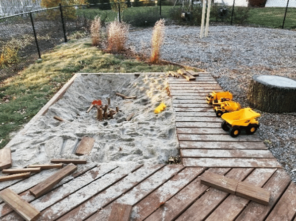 playground sandbox with toys